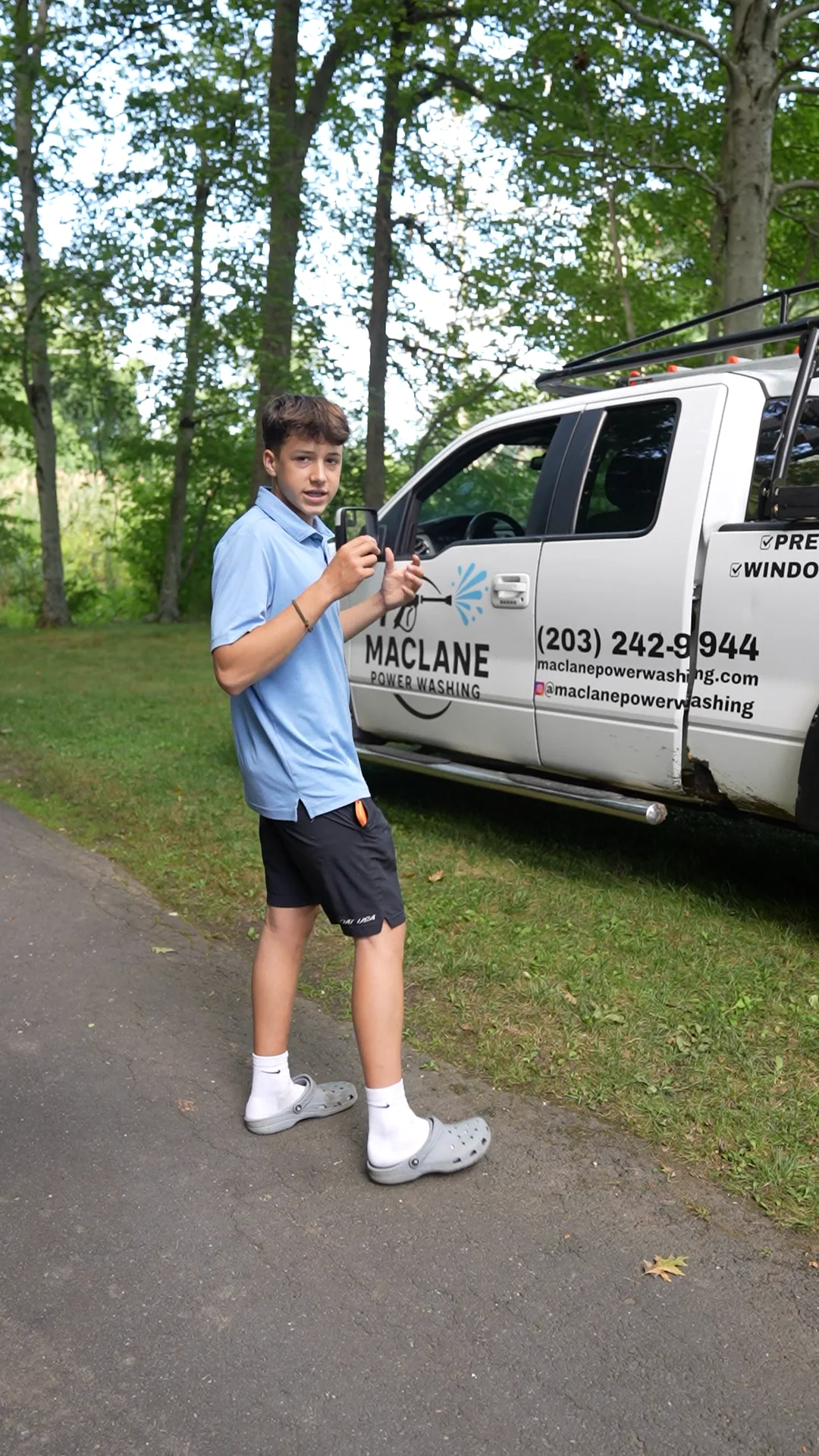 Henry MacLane beside the MacLane Power Washing truck